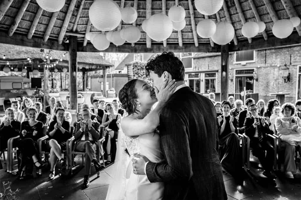 You may kiss the bride moment during the wedding ceremony under the haystack at Wedding venue Wapen van Zoetermeer the Netherlands © Stefan van Beek Photography